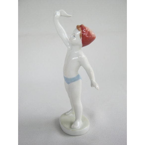 Integető fiú porcelán figura